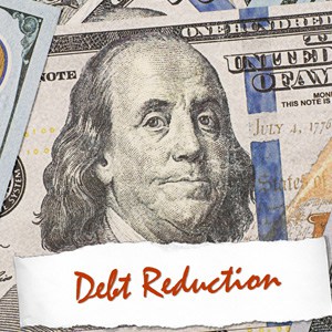 Dollar currency note and heading of debt reduction - Big Catch Consulting